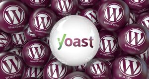 Un grupo de esferas granates con el logotipo de WordPress rodea una esfera central blanca con el logotipo de Yoast.