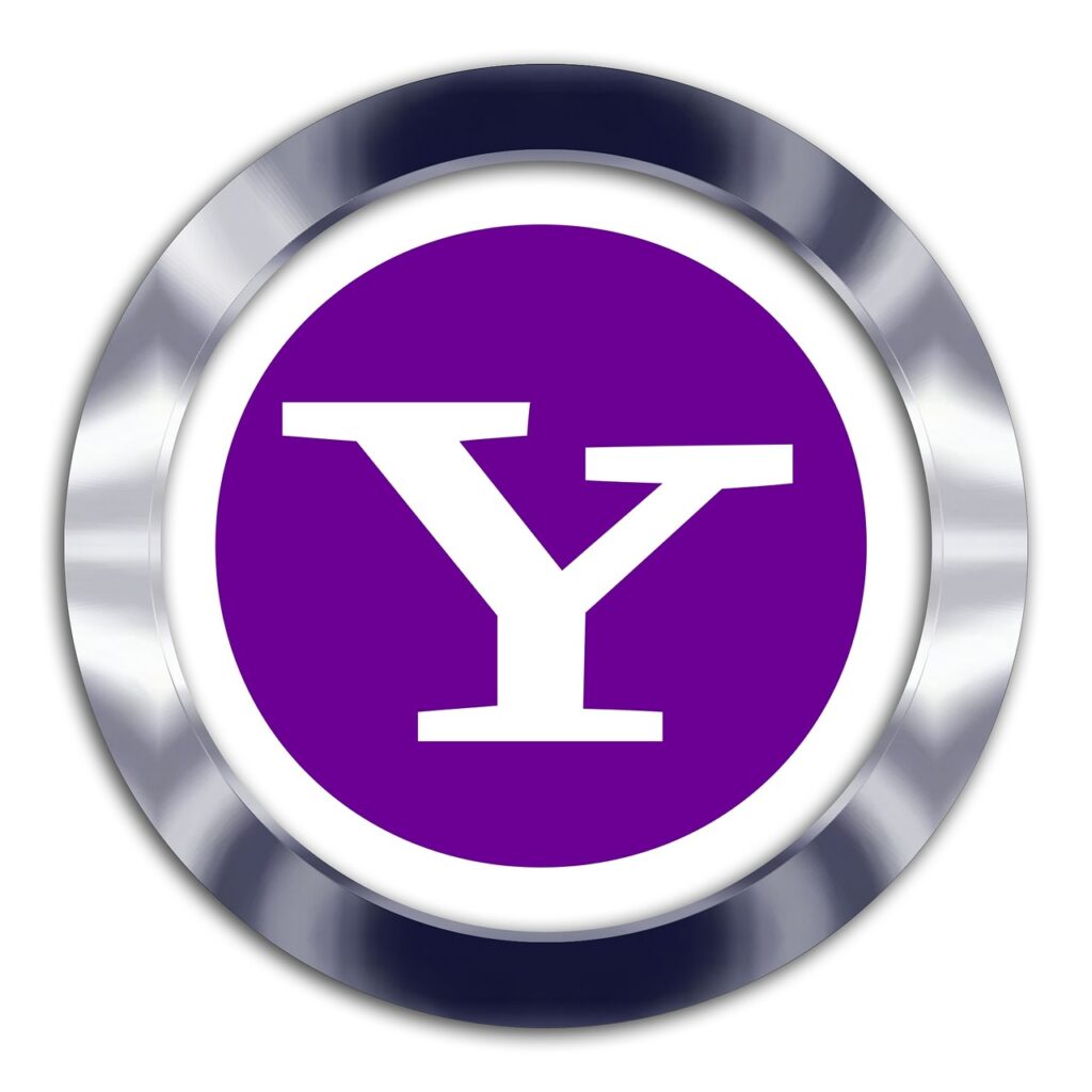 Un marco circular metálico rodea un círculo morado con una audaz letra "Y" blanca en el centro, que representa el logotipo de Yahoo.
