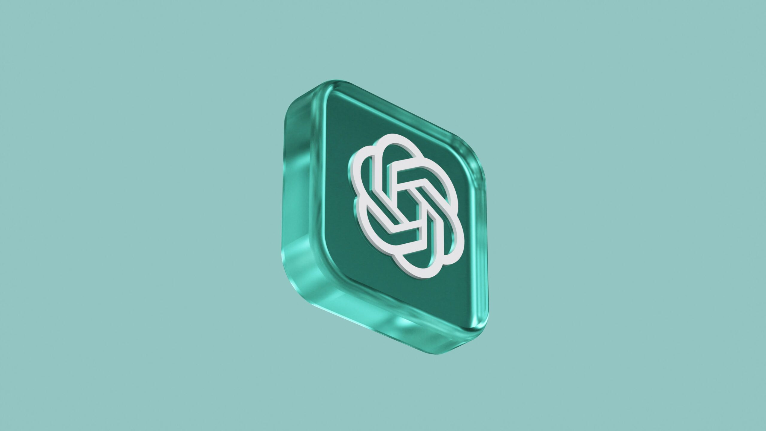 Un botón 3D cuadrado de color verde azulado con el logotipo de OpenAI en blanco, flotando sobre un fondo sólido de color verde azulado claro.
